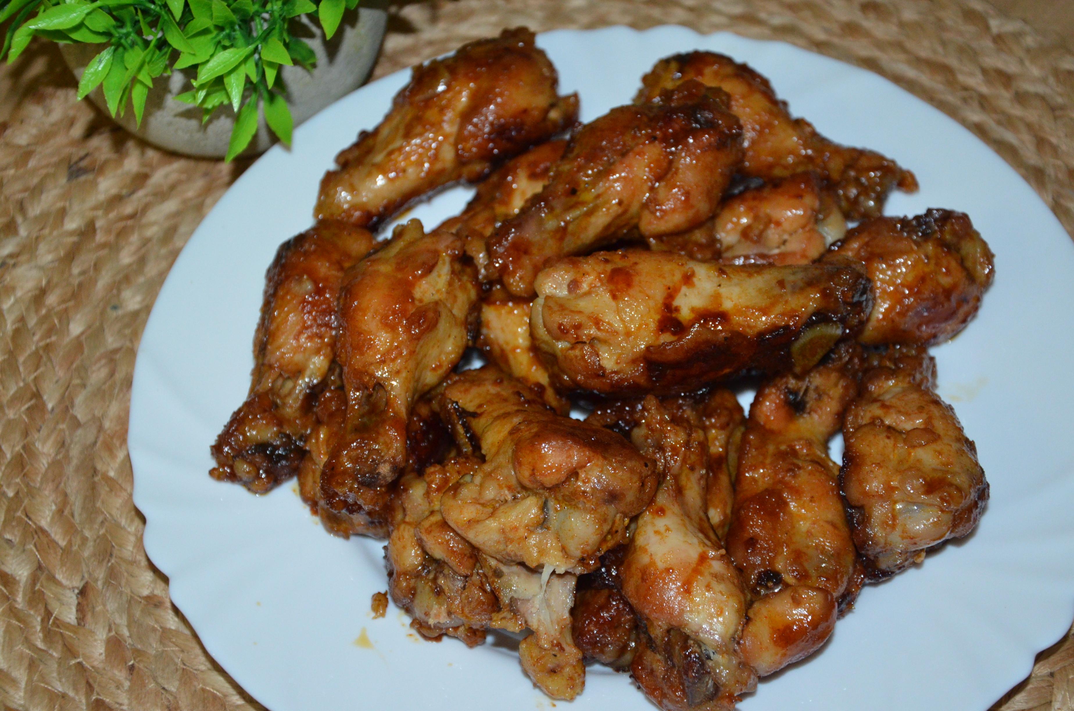 Курячі плечики(крильця) в апельсиновому соусі.