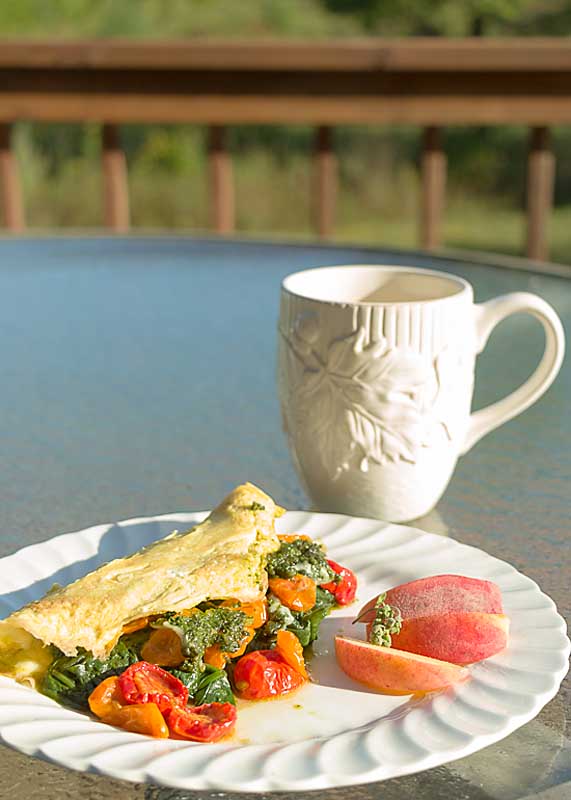 roasted tomato omelet with spinach, pesto & cheese