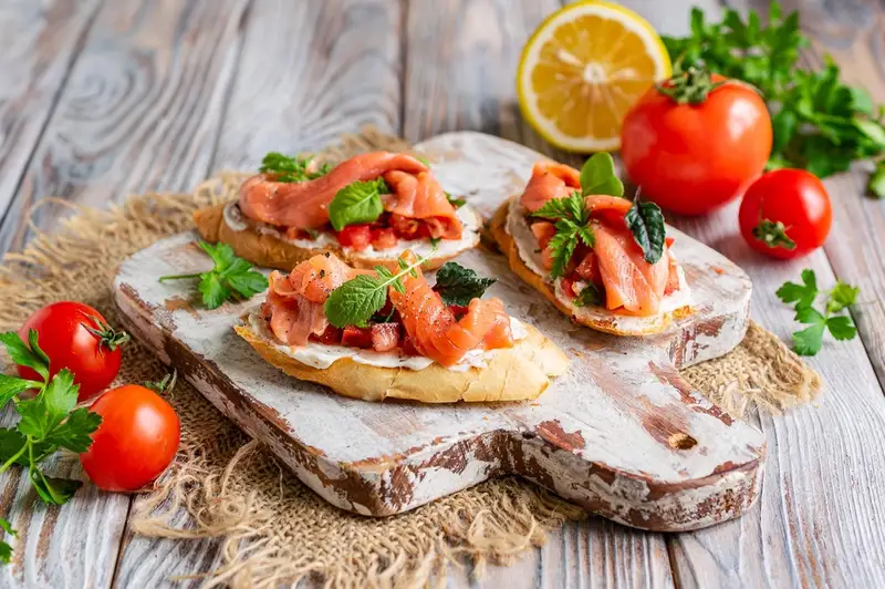 Bruschetta with salted salmon, cream cheese and tomatoes